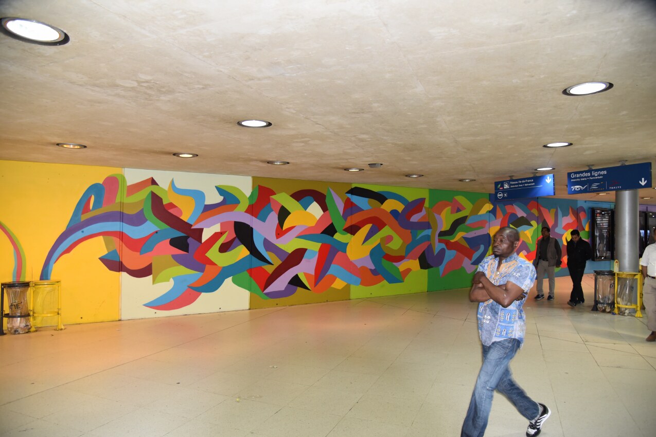 Wide view showing the scale of Kool Koor’s Gare du Nord mural