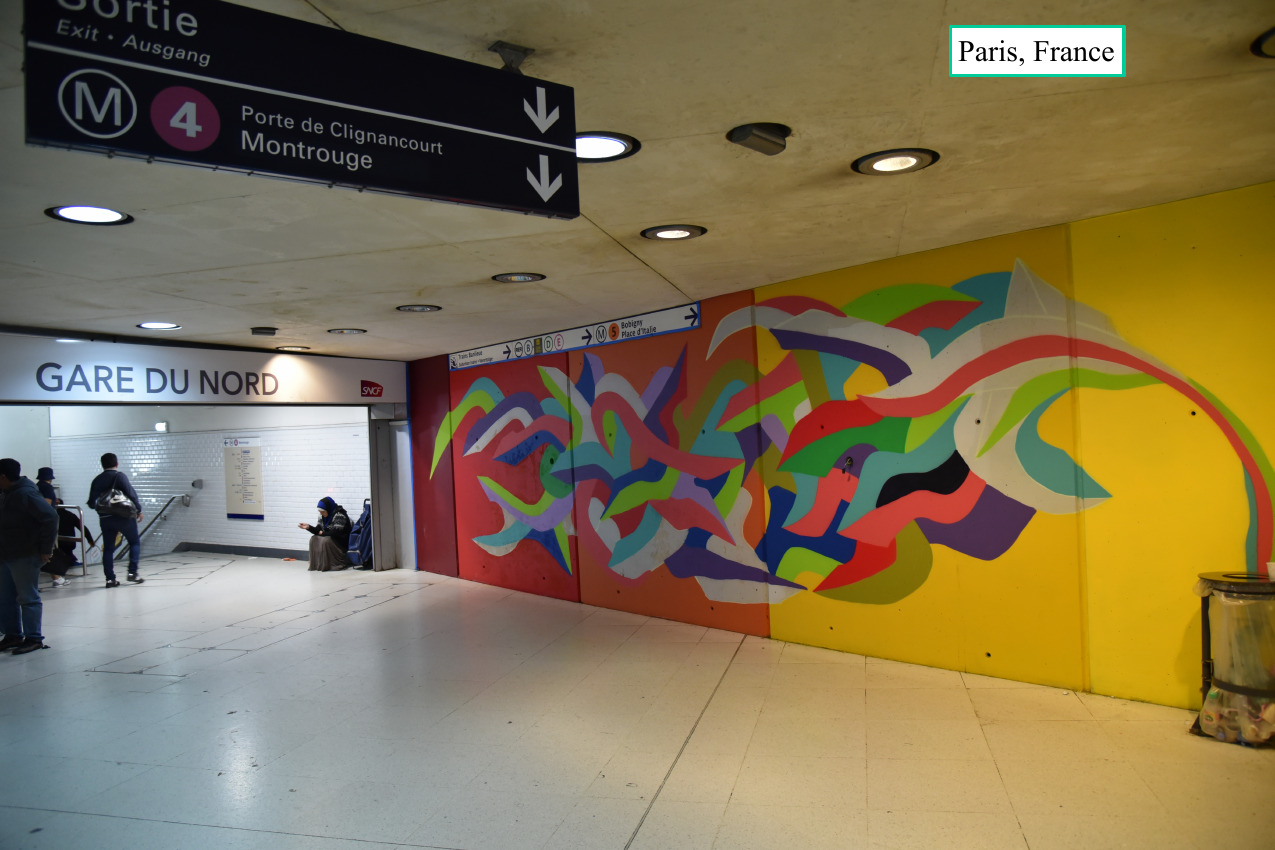 Kool Koor mural beside the Gare du Nord station signage in Paris