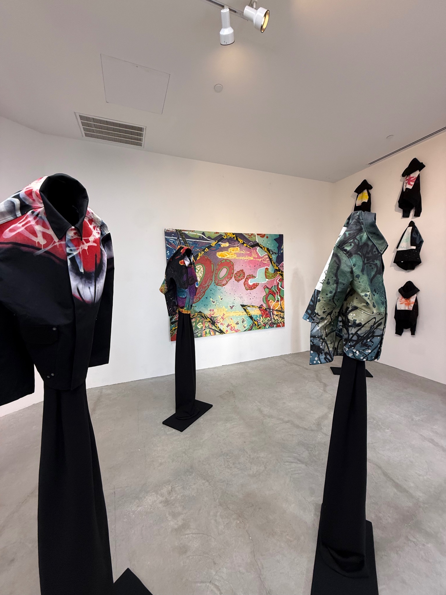 Limited edition garments installed on the gallery wall